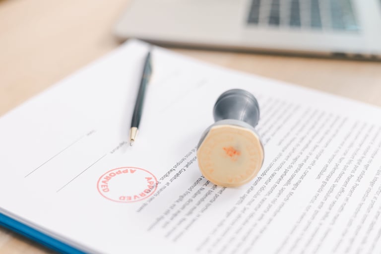 Close up approved stamp on signed document with pen on desk, concept of successful business contract, legal authorization, agreement approval or financial verification process. approved stamp