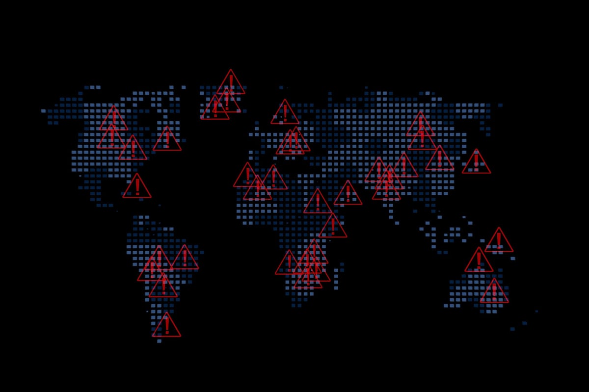 A world map displays red triangles indicating warning zones across different countries.