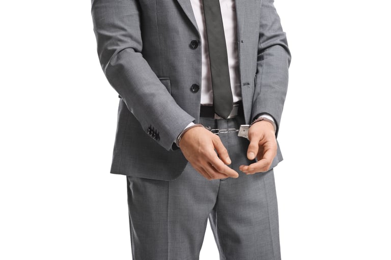 Businessman with handcuffs