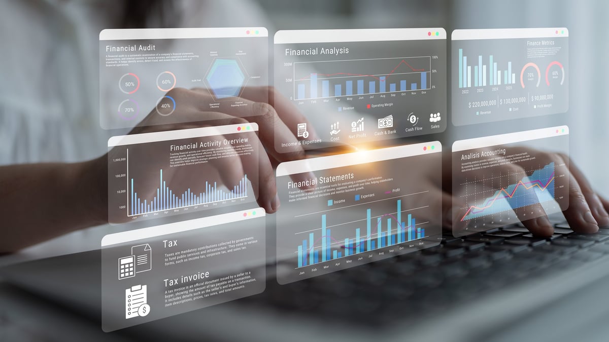 Close-up of hands typing on a keyboard with various financial graphics and charts overlaid, emphasizing data analysis and insights for business decision-making.