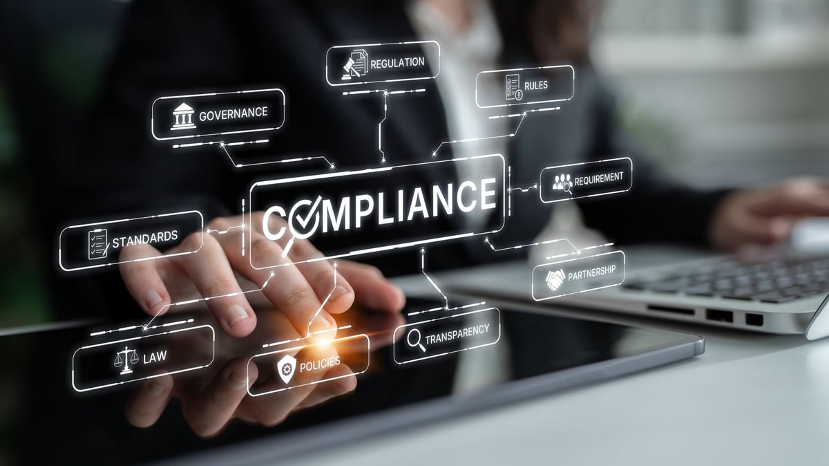 A business professional interacts with a digital interface showcasing key compliance concepts, emphasizing the importance of governance, regulation, and transparency in modern organizations.